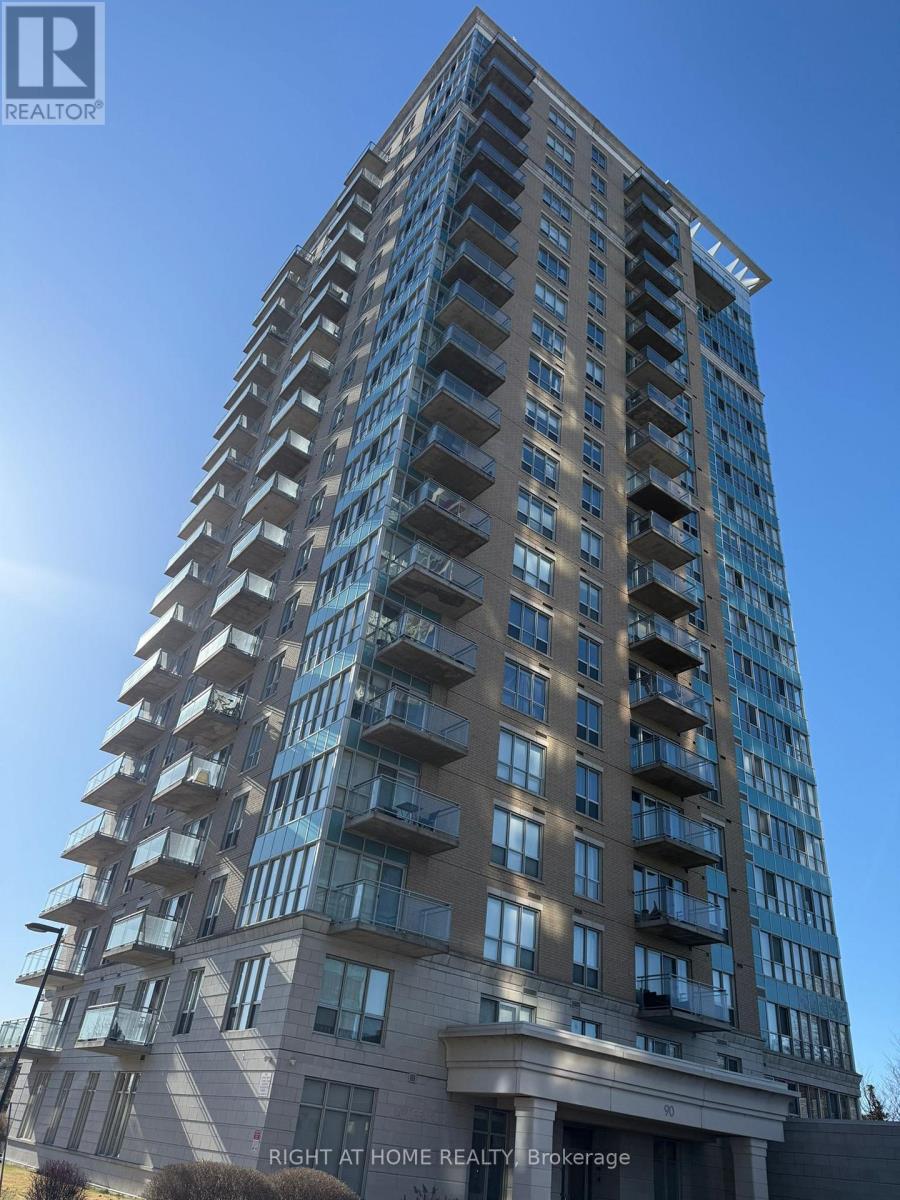 A tall building with balconies on the upper floors.