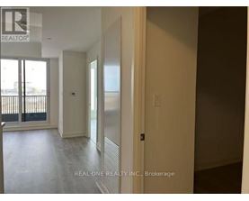 A room with a sliding glass door and a wall with a window.