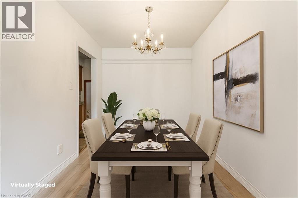 A dining room with a table set for a meal.