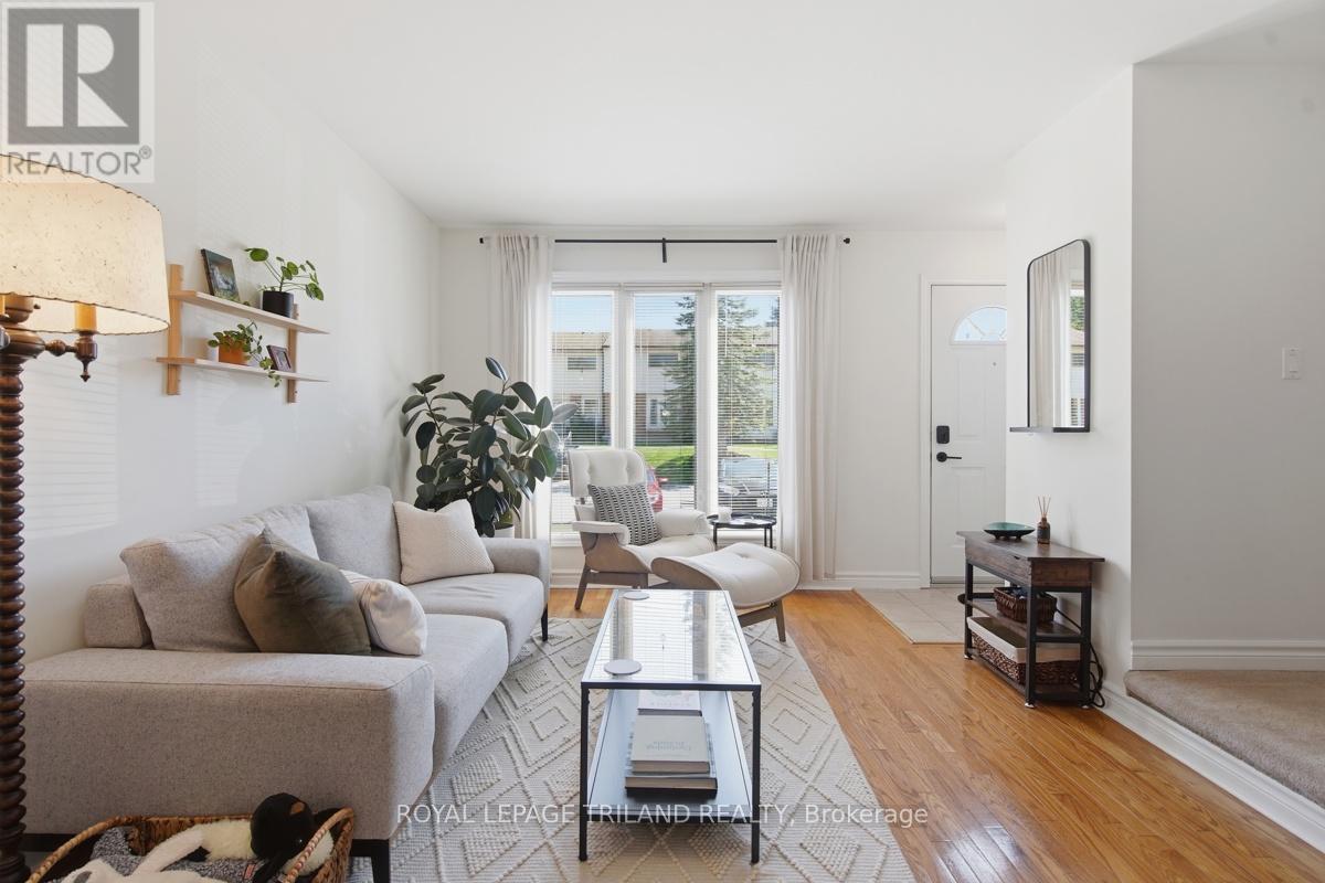 A living room with a grey couch and a coffee table.