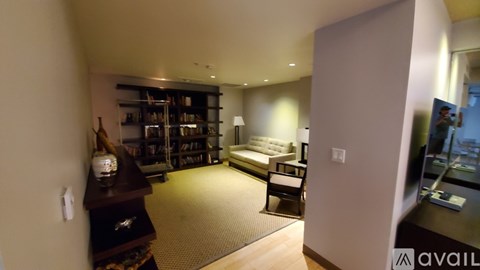 A living room with a couch and a television.