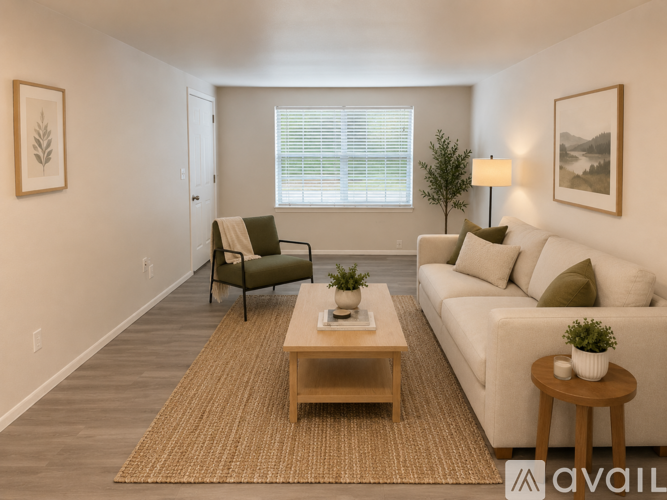 A living room with a couch, chair, and coffee table.