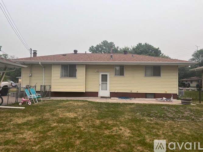 A house with a lawn in front of it.