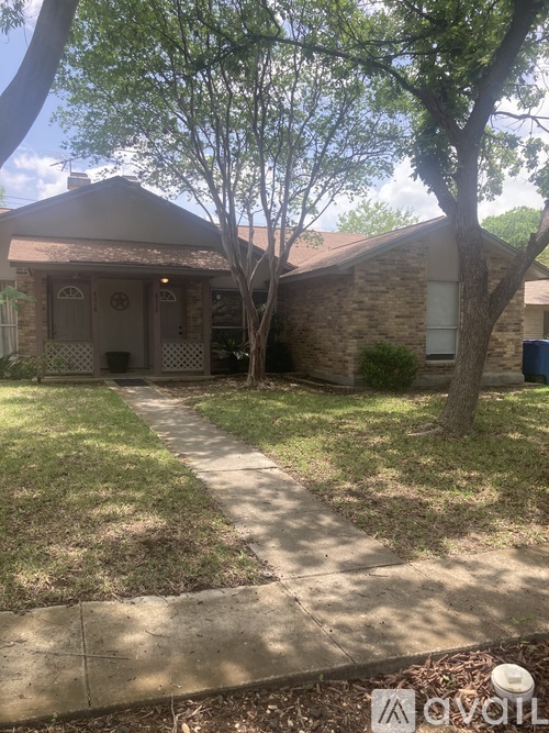 A house with a tree in front of it.