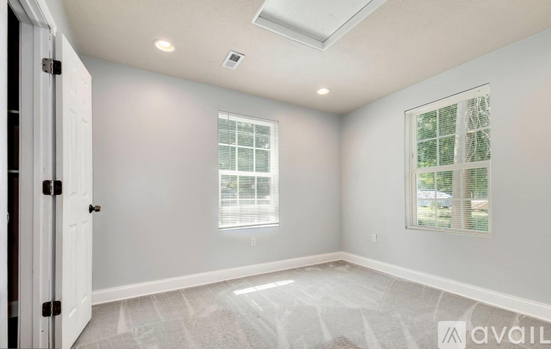 A room with a window and a door.