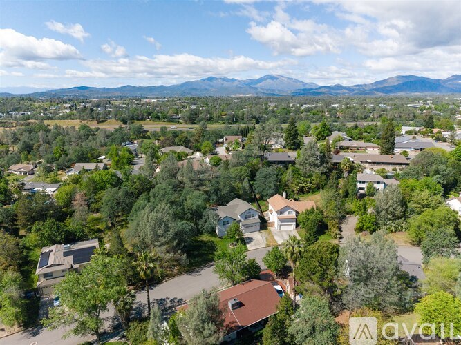 A bird's eye view of a residential area with houses and trees.