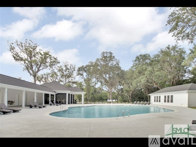 A large house with a pool in the backyard.