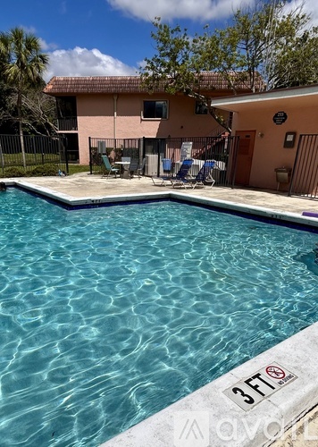 A swimming pool with a 3ft sign on the edge.