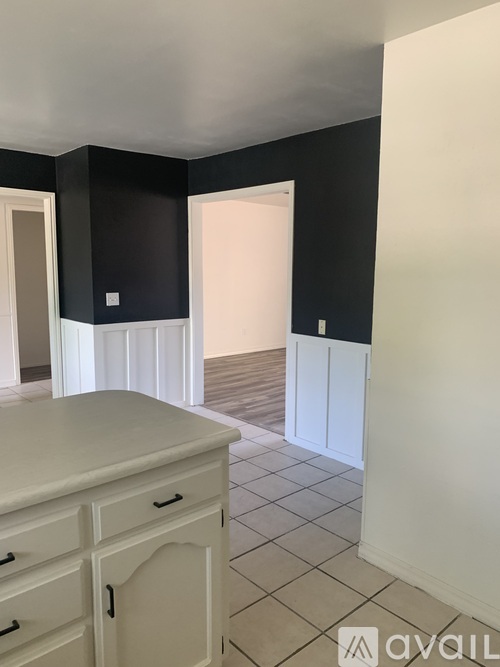 A room with black walls and white trim.