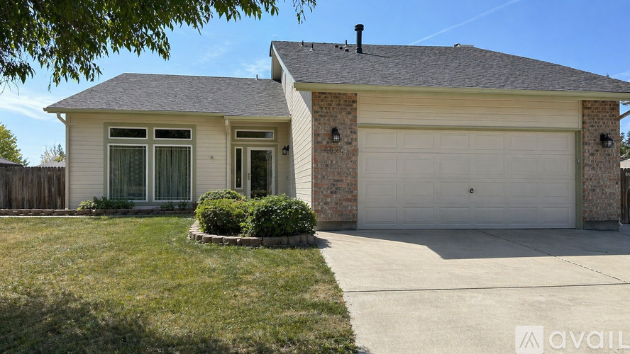 A house with a garage and a driveway.