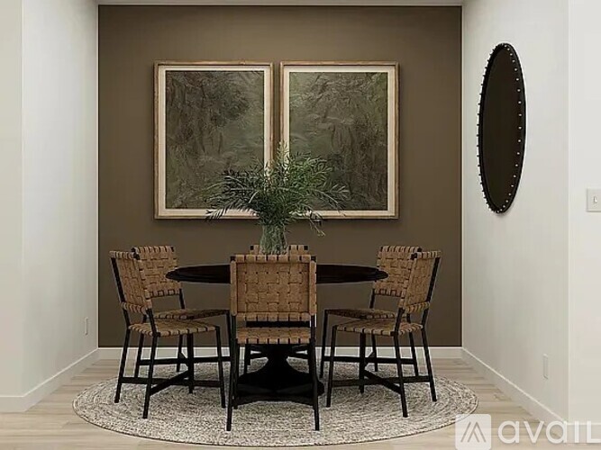 A dining room with a table and chairs.