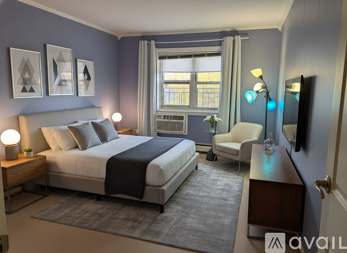A bedroom with a large bed and a chair.