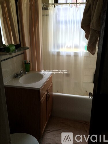 A bathroom with a sink, toilet and bathtub.