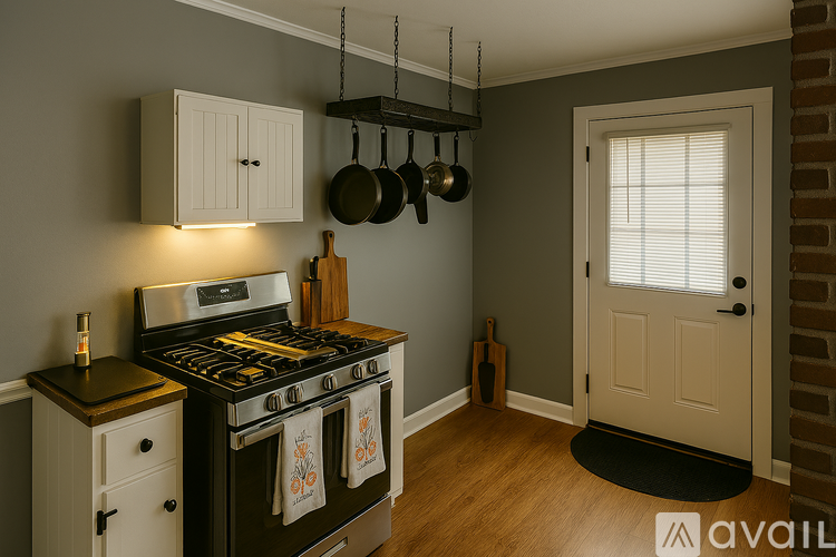 A kitchen with a stove and a cabinet.