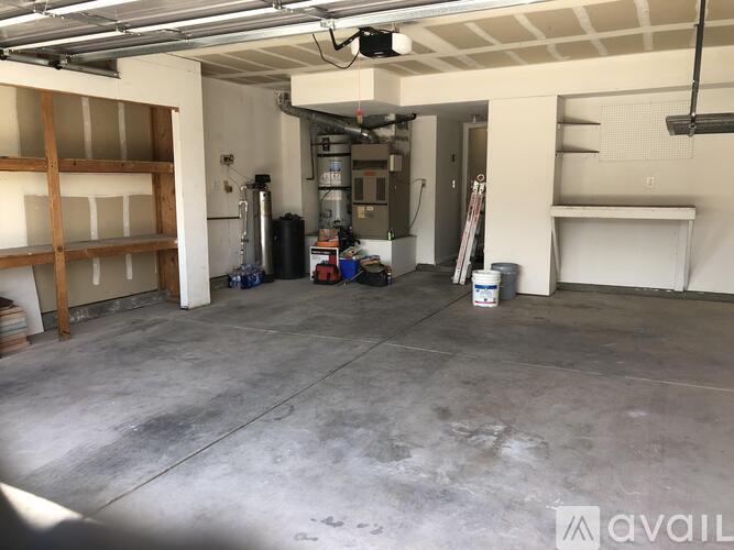 A spacious garage with a concrete floor and a white ceiling.