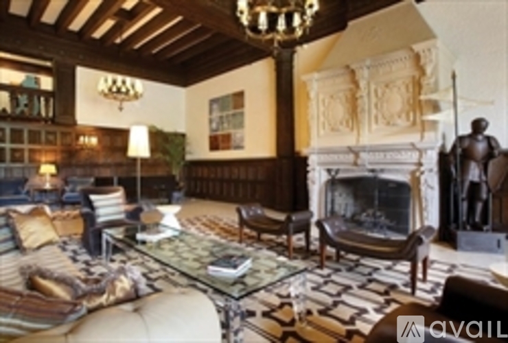 A living room with a fireplace and a chandelier.