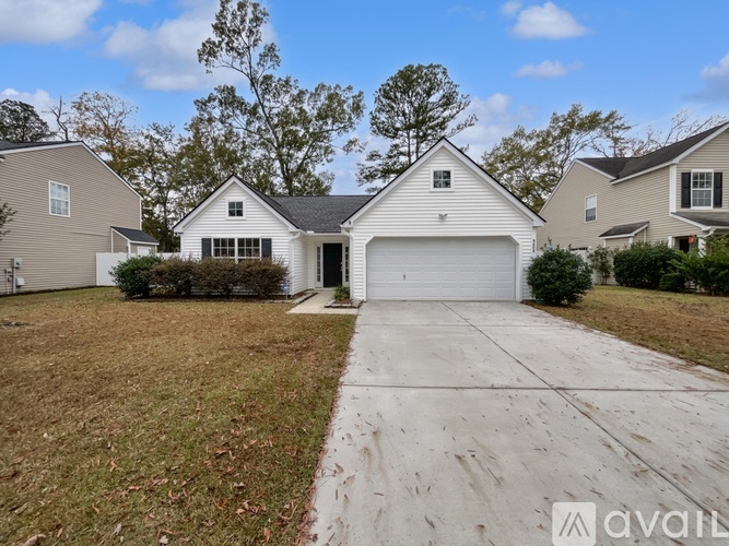 A house with a garage is available for sale.