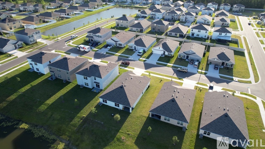 A bird's eye view of a suburban neighborhood with houses and streets.