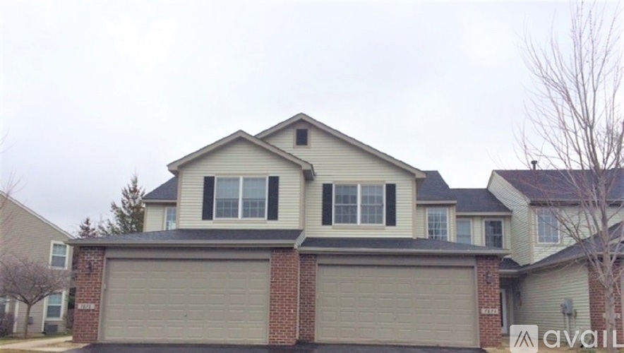 A house with a garage is for sale.