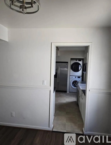 A laundry room with a washer and dryer in it.