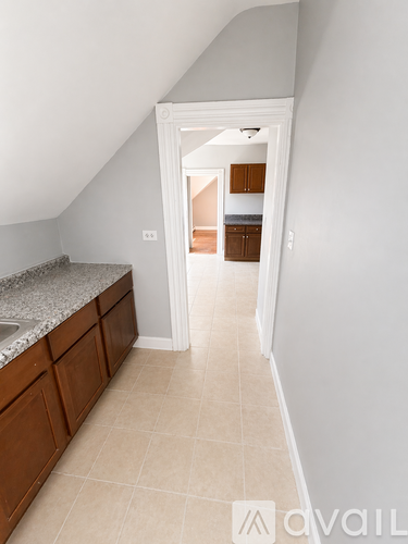 A kitchen with a sink and cabinets.