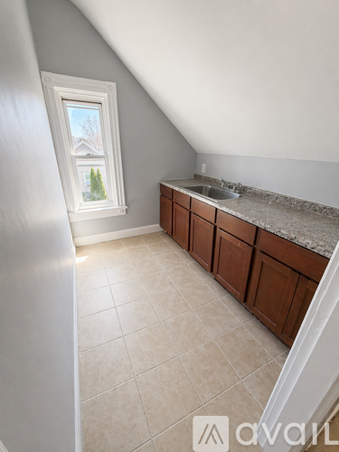 A kitchen with a window and a sink.