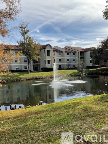 A large building with a fountain in front of it.