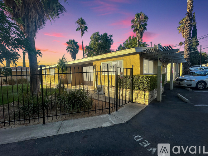 A house with a carport and a car parked in front.