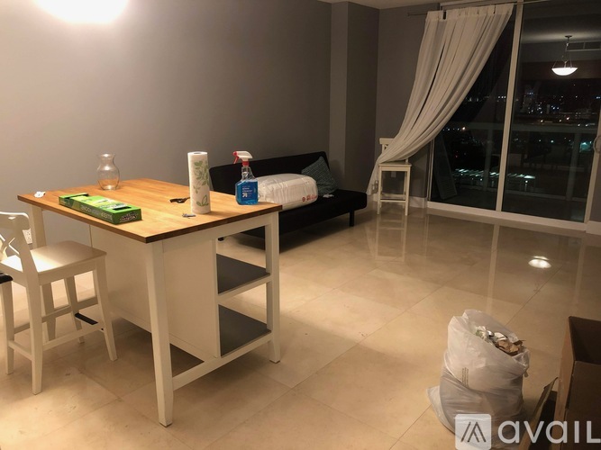 A modern living room with a dining table and a sofa.