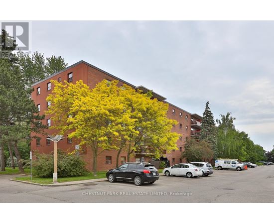 A building with a tree in front of it.
