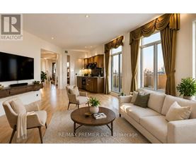 A living room with a couch, chairs, and a coffee table.