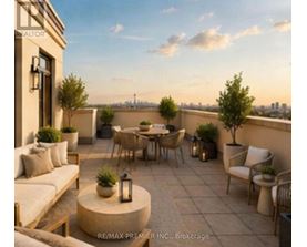 A patio with a table and chairs is set up on a balcony.