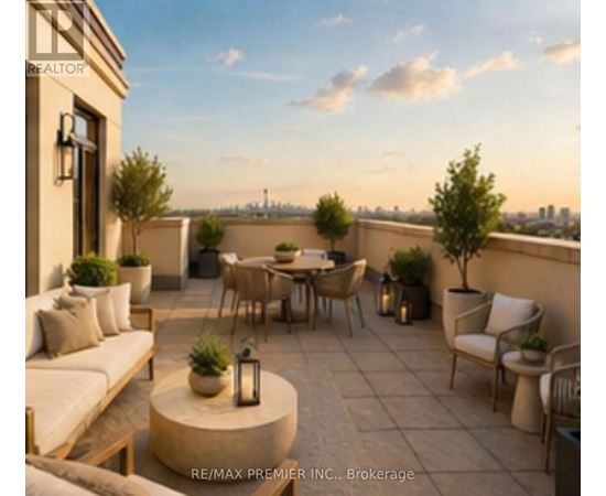 A patio with a table and chairs is set up on a balcony.