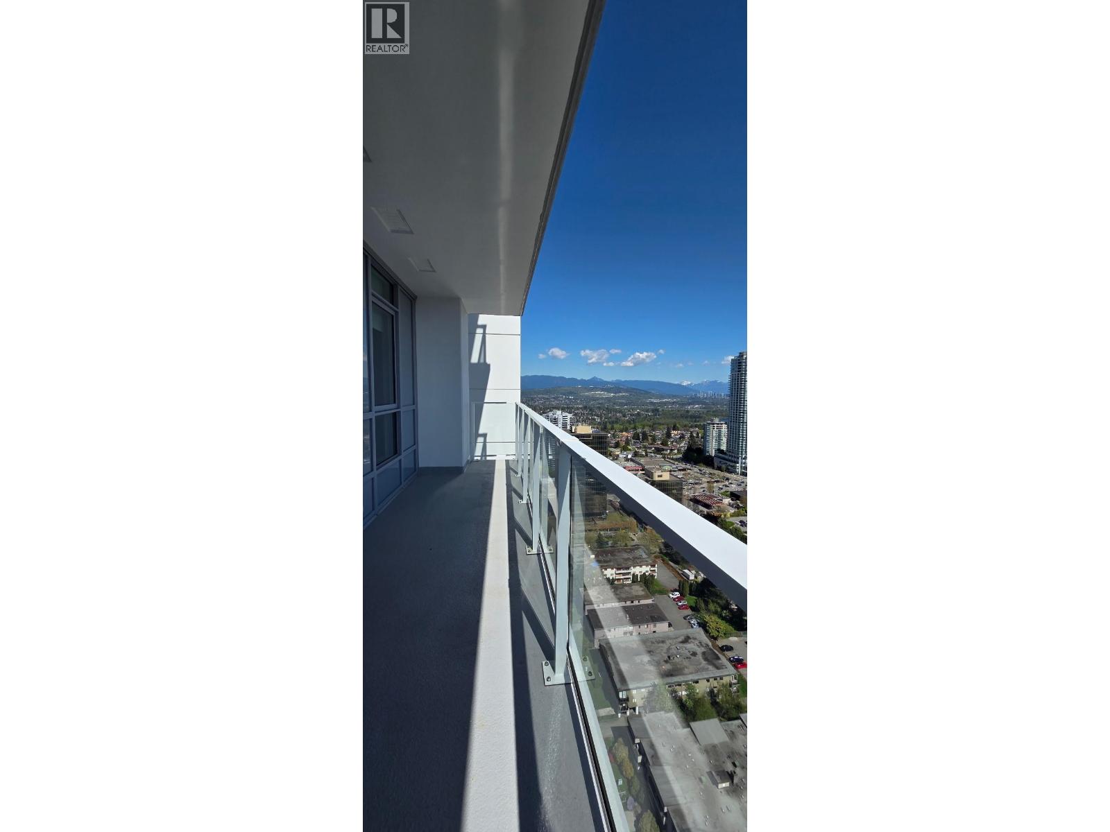 A view from a high-rise building looking out over a cityscape.
