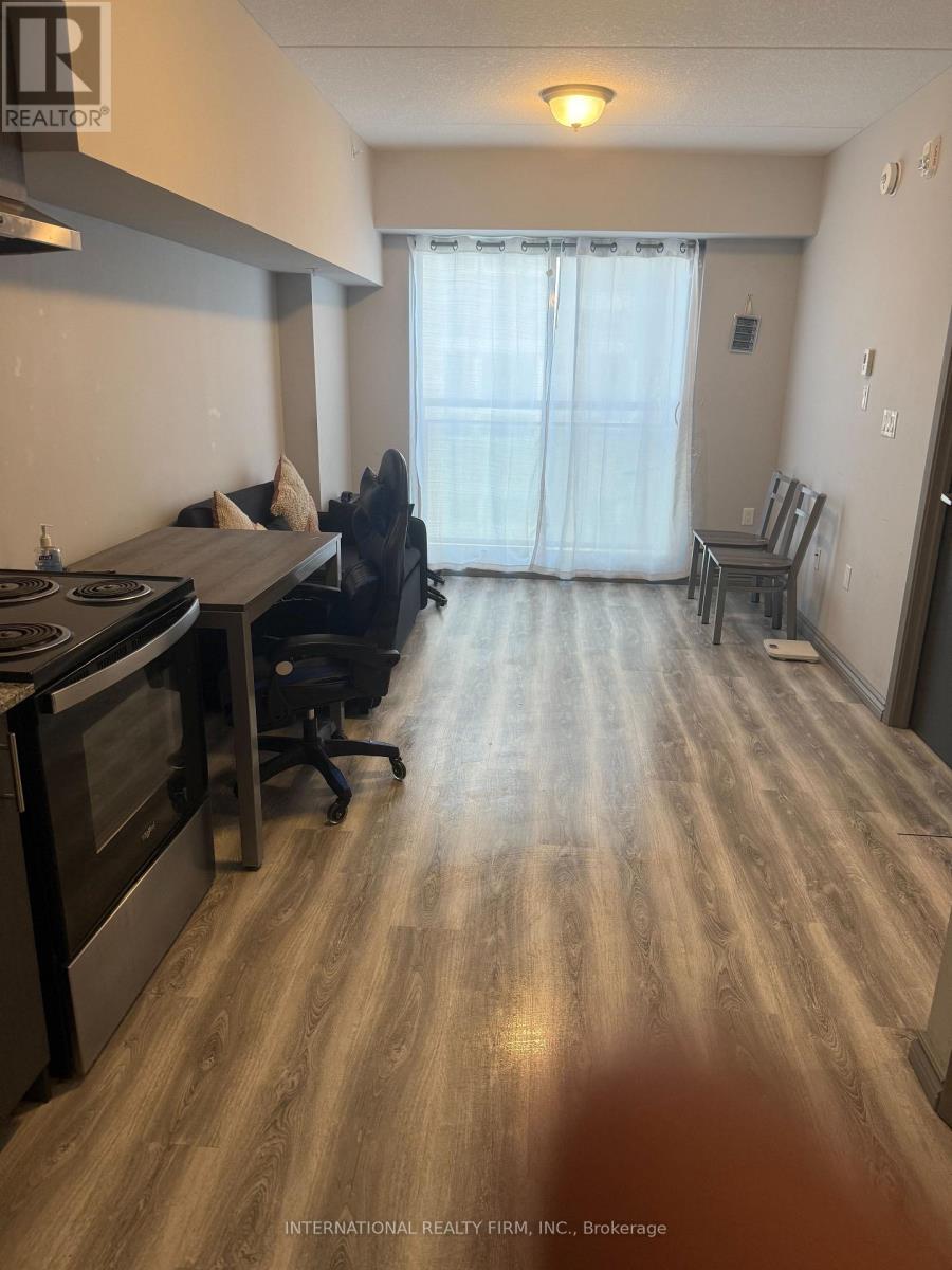 A spacious kitchen with a dining table and chairs.