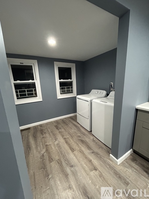 A laundry room with a washer and dryer.