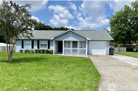 A house with a blue and white exterior is for sale.