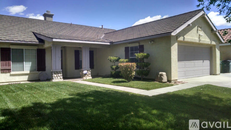 A house with a garage is for sale.