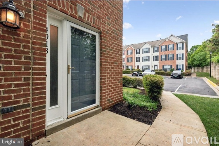 A brick building with a glass door and a window.