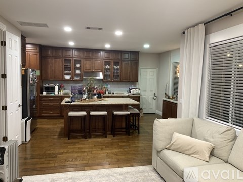 A kitchen with wooden cabinets and a white refrigerator.
