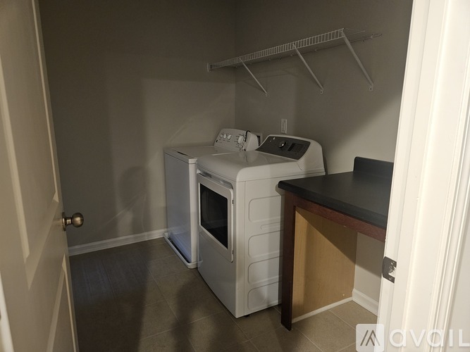 A small kitchen with a microwave and oven.