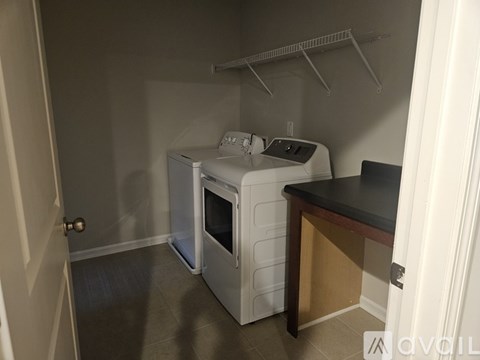 A small kitchen with a microwave and oven.