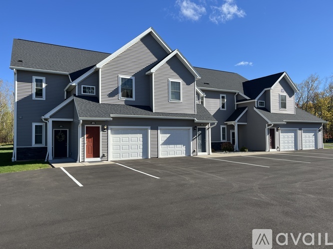 A large house with a garage is available for sale.