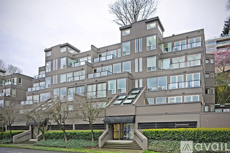 A large, modern building with a flat roof and a lot of windows.