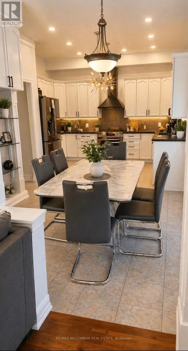 A modern kitchen with a dining table set for four.
