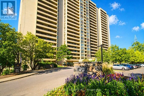 A tall building with a sign that says REALTOR in the top left corner.