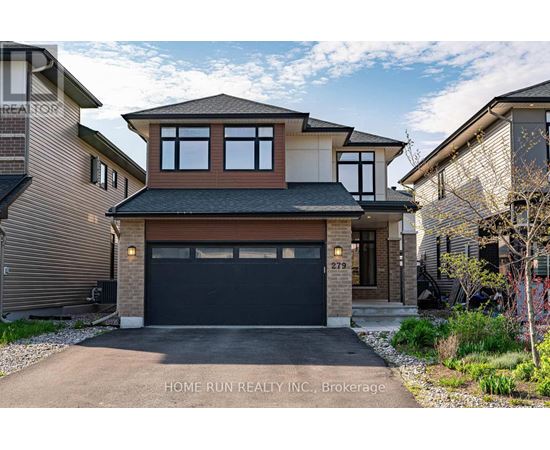A two-story house with a garage is for sale.