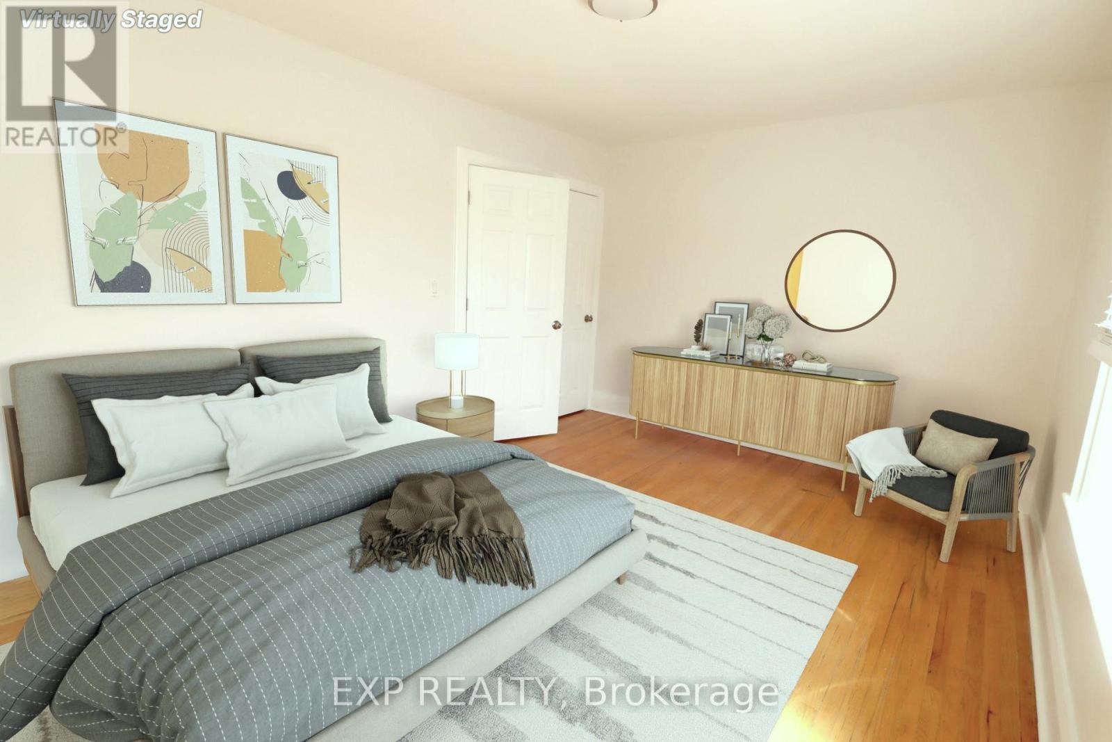 A bedroom with a large bed and a chair.