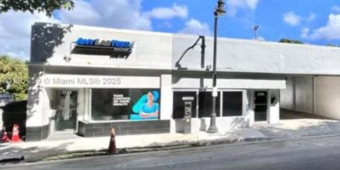 A building with a blue and white sign that reads "Miami MLS 2025".