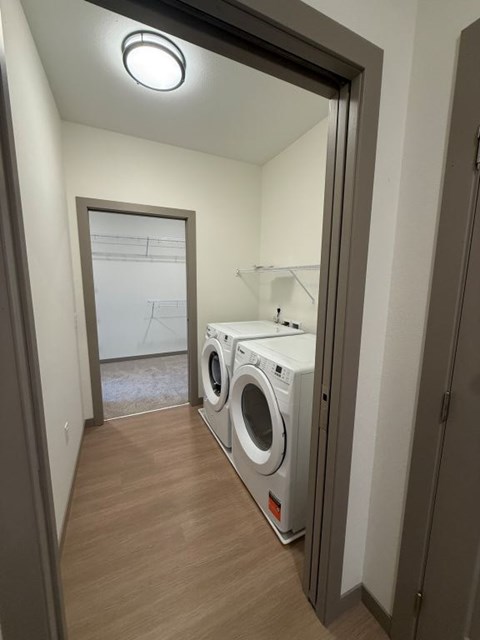 A laundry room with a washer and dryer.